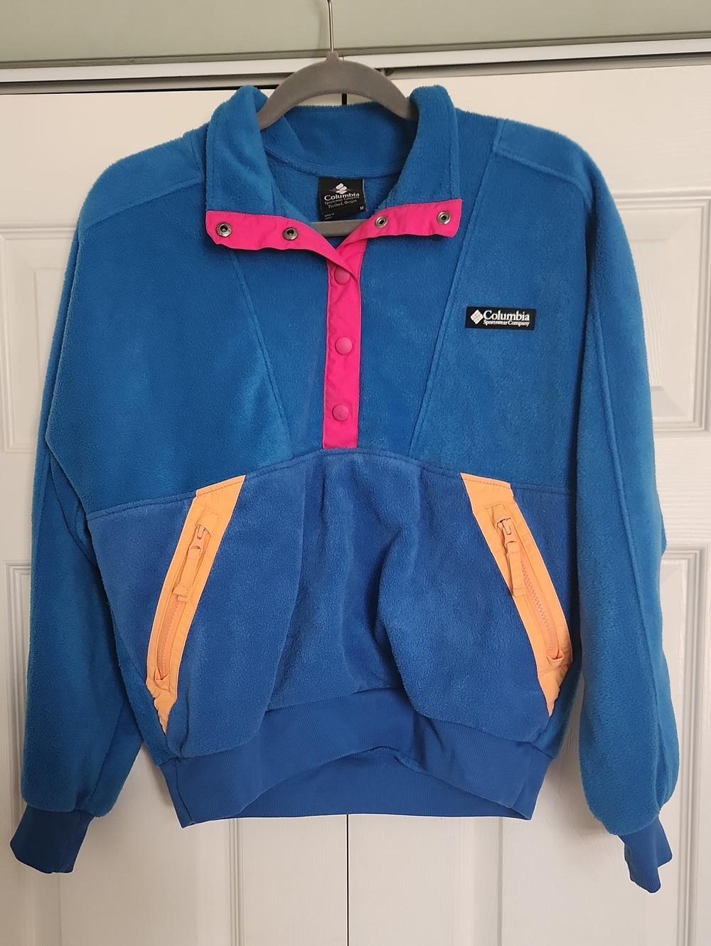 Columbia Blue Fleece Pullover with Pink Snap Placket & Orange Zippered Pockets